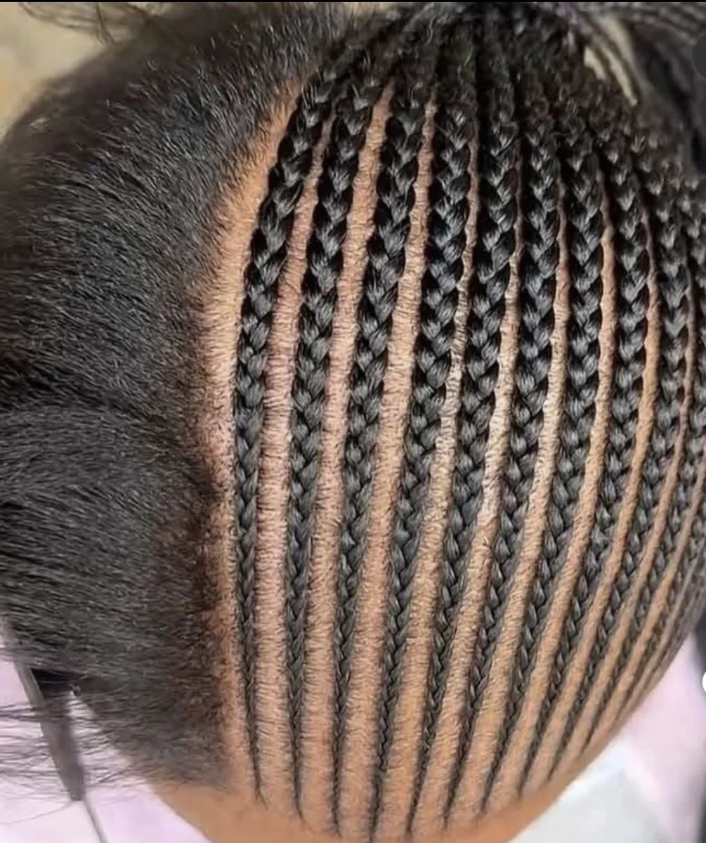 Small straight-back cornrows with clean parts, close-up